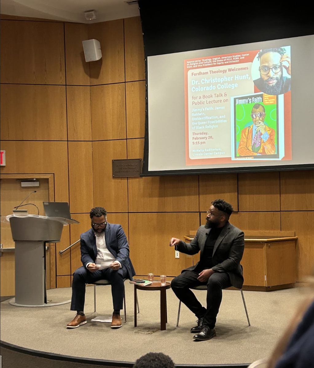 Dr. Christopher Hunt and Dr. Rufus Burnett spoke about Hunt’s book at McNally Ampitheater. (Allison Schneider/The Fordham Ram)